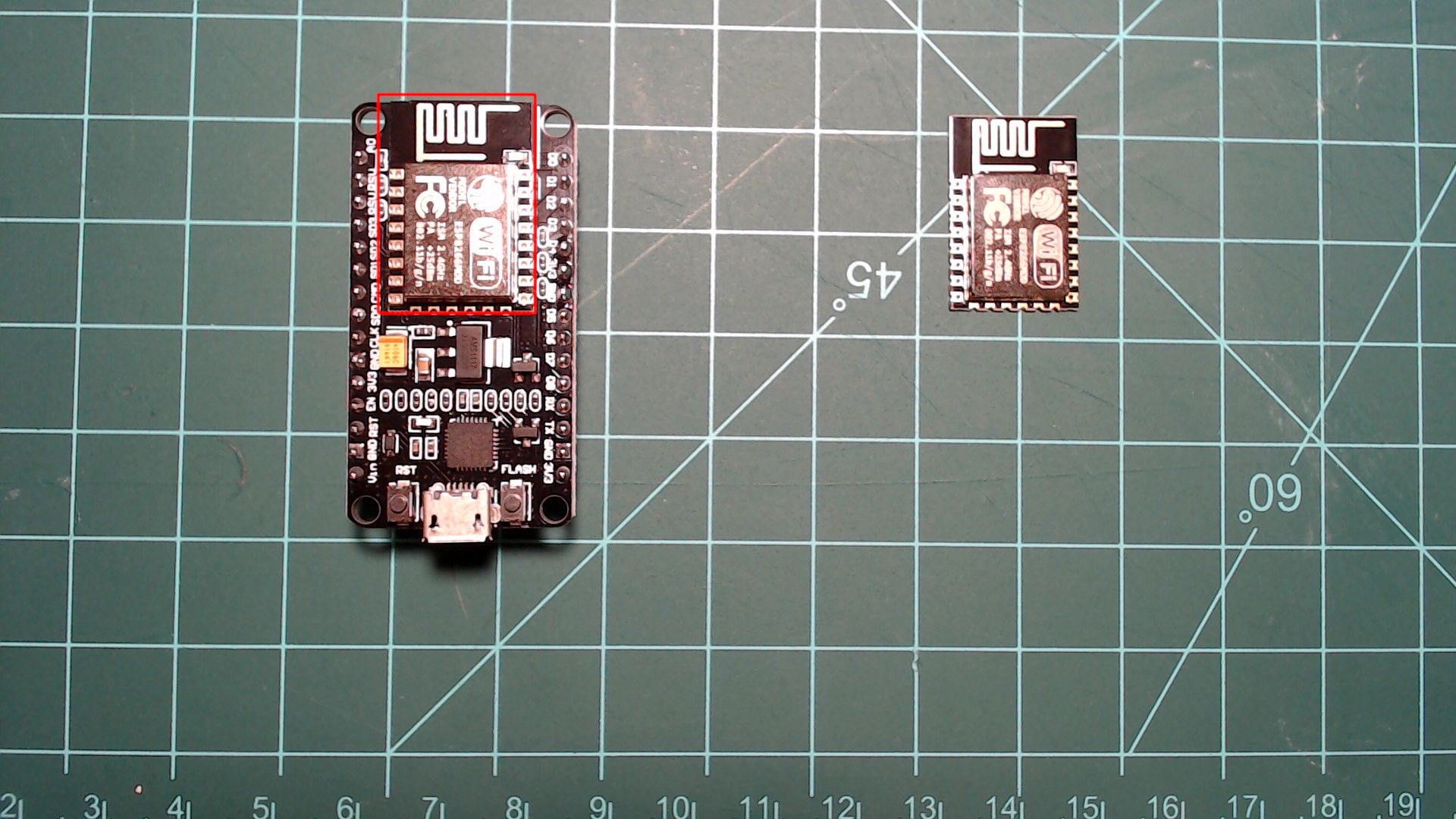 A black NodeMCU board with a red box around the ESP8266 module soldered at its top, beside a loose ESP8266 module that looks the same; the board adds pins down both long sides, a micro-USB port and RST and FLASH buttons.