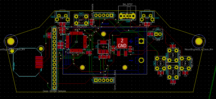 KiCad's board layout: a wide outline with angled sides and a mounting hole at each end. The STM32F051R8 sits left of centre with the 16-pin screen header down the left side, two buttons, the Xbee header and the power switch along the top, the regulators in the middle, the programming header at the bottom and four buttons in a diamond at the right, joined by red and green traces.
