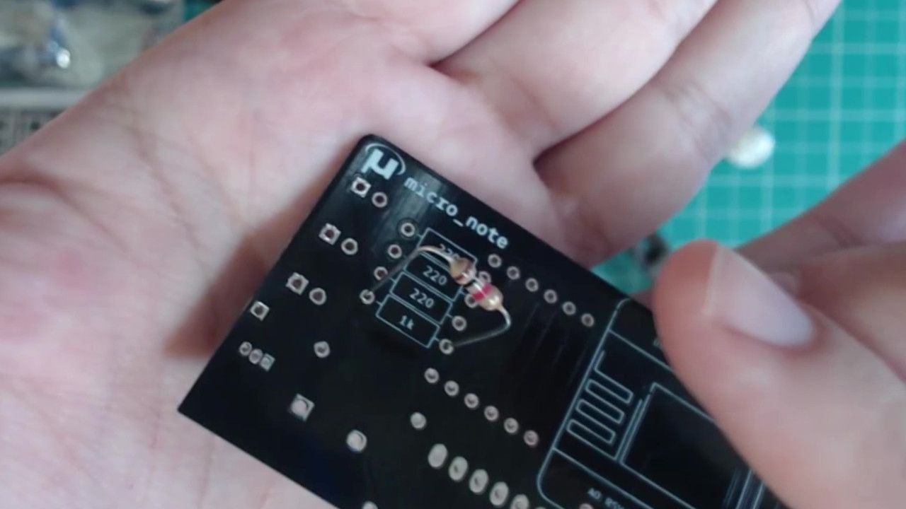 The 1k resistor loosely in place on the PCB.