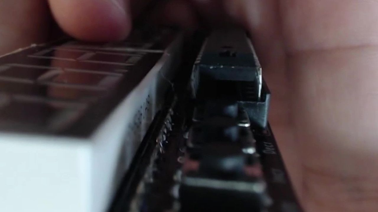 Line the up the straightened IC pins with the socket.