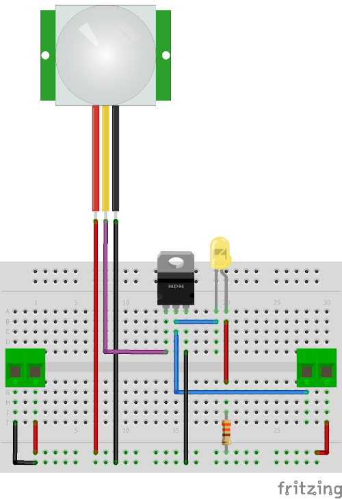 The circuit from the previous picture without the breadboard power supply, and with a green two-pin screw terminal at each end. The left terminal's wires go to the power rails; of the right terminal's, one goes to the positive rail and the other, by a blue wire, to the MOSFET's middle pin, beside the LED.