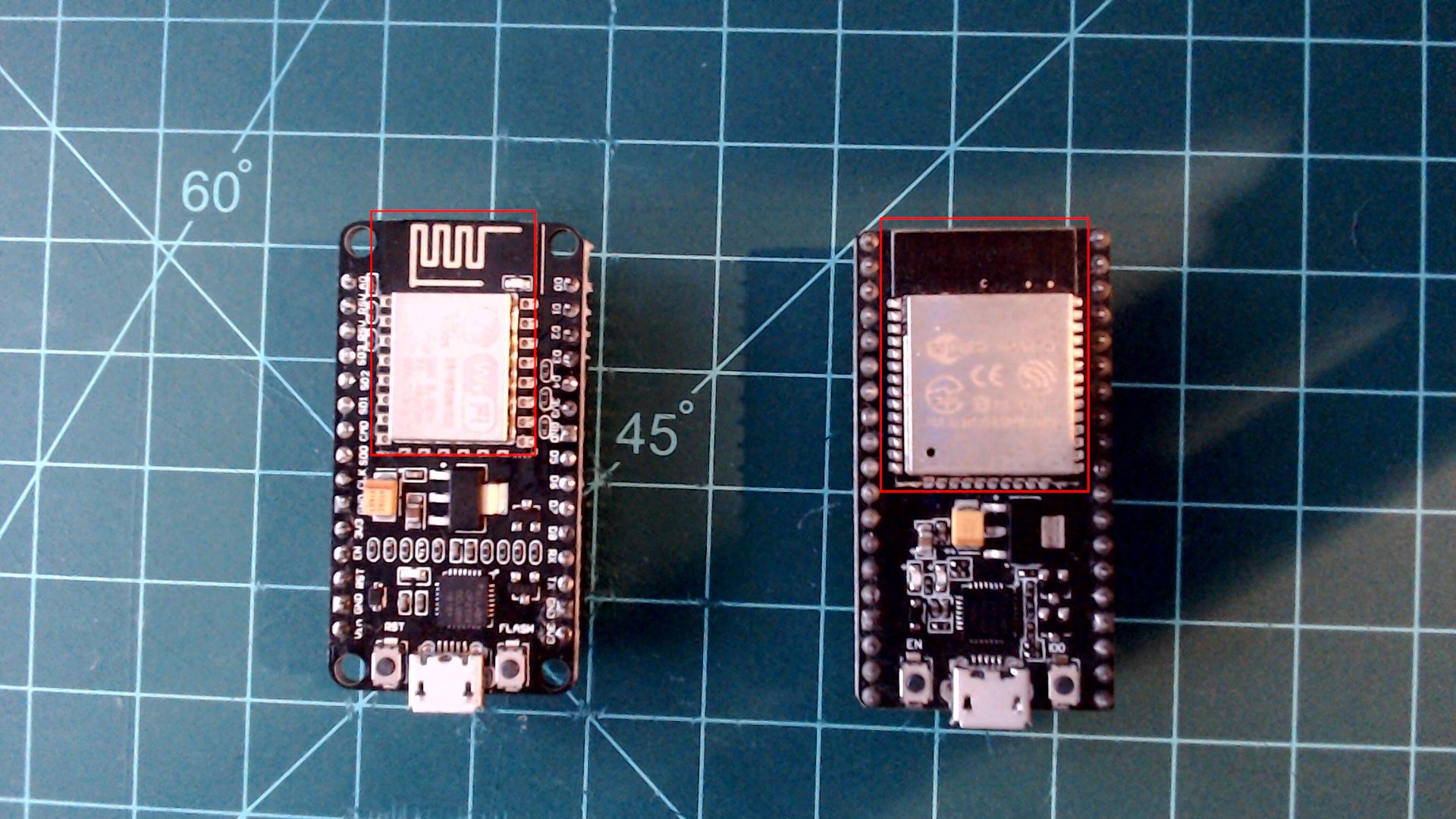 Two black NodeMCU boards side by side, each with its module outlined in red: on the left the ESP8266 board with RST and FLASH buttons, on the right a slightly longer ESP32 board with more pins and EN and IO0 buttons, both with a micro-USB port at the bottom.